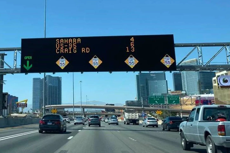 Large LED sign above busy highway in Nevada