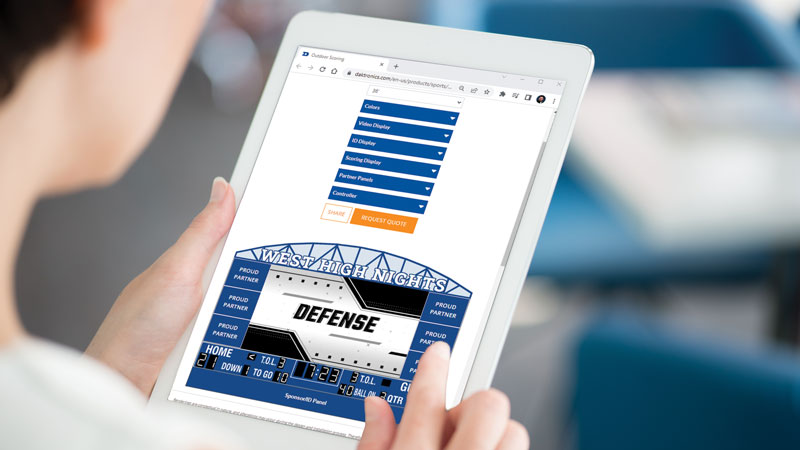 person designing a scoreboard with a jumbotron